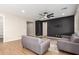 Stylish living room with modern accent wall and tile flooring at 23020 E Excelsior Ave, Queen Creek, AZ 85142