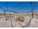 Inviting outdoor patio area with stone flooring, shaded seating, and views of the surrounding neighborhood at 23020 E Excelsior Ave, Queen Creek, AZ 85142