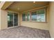 Covered patio with paver flooring, sliding glass door and neighborhood views at 23020 E Excelsior Ave, Queen Creek, AZ 85142