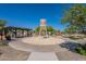 Community playground featuring a water tower play structure, covered picnic area, and plenty of space to play at 23020 E Excelsior Ave, Queen Creek, AZ 85142