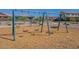 Fun playground area with swings and climbing structures, surrounded by a soft, safe surface at 23020 E Excelsior Ave, Queen Creek, AZ 85142