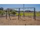 Well-equipped playground with a variety of swings, set amidst a beautifully landscaped park area at 23020 E Excelsior Ave, Queen Creek, AZ 85142