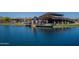 Stunning community building overlooking a serene pond, perfect for outdoor gatherings and relaxation at 23020 E Excelsior Ave, Queen Creek, AZ 85142