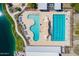 Aerial shot of a community pool area showcasing lap lanes, leisure pool, and sunbathing areas at 23020 E Excelsior Ave, Queen Creek, AZ 85142