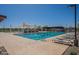 Community pool featuring lap lanes, lounge chairs, shade structures, and poolside tables for residents' enjoyment at 23020 E Excelsior Ave, Queen Creek, AZ 85142