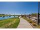 Walking path by the lake, a beautiful amenity for residents, located in a welcoming community at 23020 E Excelsior Ave, Queen Creek, AZ 85142