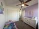 Bright bedroom with a dresser, twin bed and a closet with sliding doors at 2329 E Juanita Ave, Mesa, AZ 85204