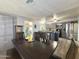 Open kitchen and dining area featuring gray cabinets and stainless steel appliances at 2329 E Juanita Ave, Mesa, AZ 85204