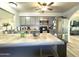 Bright kitchen featuring gray cabinetry, stainless steel appliances, and spacious tile countertop island at 2329 E Juanita Ave, Mesa, AZ 85204