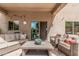 Relaxing covered patio with stylish furniture, perfect for outdoor entertaining and enjoying the backyard view at 26011 W Tonopah Dr, Buckeye, AZ 85396