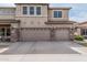 Lovely two-story home featuring a spacious three-car garage and a well-manicured lawn at 26011 W Tonopah Dr, Buckeye, AZ 85396