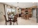 Eat-in kitchen with island, stainless appliances, sliding glass doors to outside at 26011 W Tonopah Dr, Buckeye, AZ 85396