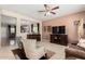 Open-concept living room features views to dining, neutral walls, and tile flooring at 26011 W Tonopah Dr, Buckeye, AZ 85396