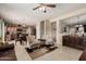 Bright living area with open floor plan to kitchen with tile flooring at 26011 W Tonopah Dr, Buckeye, AZ 85396