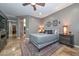 Bedroom with a queen-size bed and an ensuite bathroom at 27173 N 86Th Ave, Peoria, AZ 85383