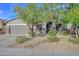 Charming single-Gathering home with desert landscaping and a two-car garage at 27173 N 86Th Ave, Peoria, AZ 85383