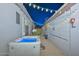 Outdoor hot tub with privacy wall and string lights at 27173 N 86Th Ave, Peoria, AZ 85383