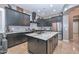 Modern kitchen with granite countertops, custom cabinetry, and stainless steel appliances, perfect for culinary enthusiasts at 27173 N 86Th Ave, Peoria, AZ 85383
