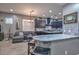 Open concept living room with a kitchen and sofas at 27173 N 86Th Ave, Peoria, AZ 85383