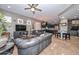 Open concept living room with a kitchen and sofas at 27173 N 86Th Ave, Peoria, AZ 85383