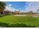 Community playground with soft green turf, shade and interactive toys for children to enjoy at 27173 N 86Th Ave, Peoria, AZ 85383