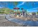 Community playground with modern play structures, shaded seating, and accessible pathways for Gathering fun at 27173 N 86Th Ave, Peoria, AZ 85383