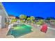 Backyard pool and lounge area with patio pavers and view of mountain range in distance at 27173 N 86Th Ave, Peoria, AZ 85383