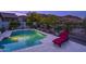 Backyard pool with mountain views, lounge chair, and lush desert landscaping at 27173 N 86Th Ave, Peoria, AZ 85383