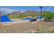 Community skate park featuring ramps, mountains in the background, and sitting area at 27173 N 86Th Ave, Peoria, AZ 85383