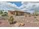 Charming backyard with covered patio and desert landscaping at 2862 N 156Th Dr, Goodyear, AZ 85395