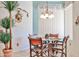 Bright breakfast nook with a glass table, comfortable seating, and natural light at 2862 N 156Th Dr, Goodyear, AZ 85395