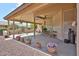 Spacious covered patio area with ample seating and desert landscape at 2862 N 156Th Dr, Goodyear, AZ 85395