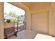 Covered entrance providing access to the garage, front door, and featuring a bench for comfortable seating at 2862 N 156Th Dr, Goodyear, AZ 85395