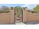 Charming courtyard gate with desert landscaping at 2862 N 156Th Dr, Goodyear, AZ 85395