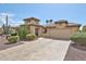 Beautiful stucco home with a tile roof, desert landscaping, and a stamped concrete driveway at 2862 N 156Th Dr, Goodyear, AZ 85395