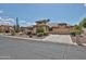 Attractive home featuring mature desert landscaping and a private driveway at 2862 N 156Th Dr, Goodyear, AZ 85395