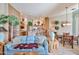 Comfortable living room with stone accents, open to the kitchen, and a breakfast nook at 2862 N 156Th Dr, Goodyear, AZ 85395