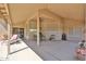 Large covered patio with ceiling fan and desert landscaping at 2862 N 156Th Dr, Goodyear, AZ 85395