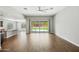 Bright living room featuring tile floors, ceiling fan, and large sliding glass doors to the yard at 31096 N 133Rd Ave, Peoria, AZ 85383