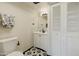 Charming bathroom with black and white tile flooring, white cabinets, and modern fixtures for a clean, updated look at 3324 S Juniper St, Tempe, AZ 85282