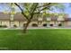 Charming townhomes with well-manicured lawns and mature trees, creating an inviting neighborhood setting at 3324 S Juniper St, Tempe, AZ 85282