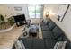 Cozy living room with blue sectional, patterned rug, and modern decor provides a comfortable and stylish space at 3324 S Juniper St, Tempe, AZ 85282