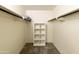 Carpeted walk-in closet with shelving and hanging racks for storage at 3324 S Juniper St, Tempe, AZ 85282
