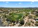 Scenic aerial view of a well-maintained golf course surrounded by desert landscape and residential community at 4817 E Cielo Grande Ave, Phoenix, AZ 85054