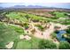 Stunning aerial view of a meticulously manicured golf course with lush green fairways and desert surroundings at 4817 E Cielo Grande Ave, Phoenix, AZ 85054