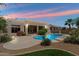 Inviting backyard boasts a sparkling pool, mature landscaping, and covered patio, perfect for outdoor living at 4817 E Cielo Grande Ave, Phoenix, AZ 85054