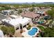 Aerial view of a desert home featuring a backyard pool, patio area, and desert landscaping at 4817 E Cielo Grande Ave, Phoenix, AZ 85054