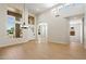 Bright and airy foyer with tile floors, clerestory windows, and arched doorway creating an inviting entrance at 4817 E Cielo Grande Ave, Phoenix, AZ 85054