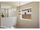Bright hallway showcasing unique architectural details and ample natural light at 4817 E Cielo Grande Ave, Phoenix, AZ 85054