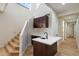 Kitchenette area with counter, sink, and cabinets next to wooden staircase at 4817 E Cielo Grande Ave, Phoenix, AZ 85054